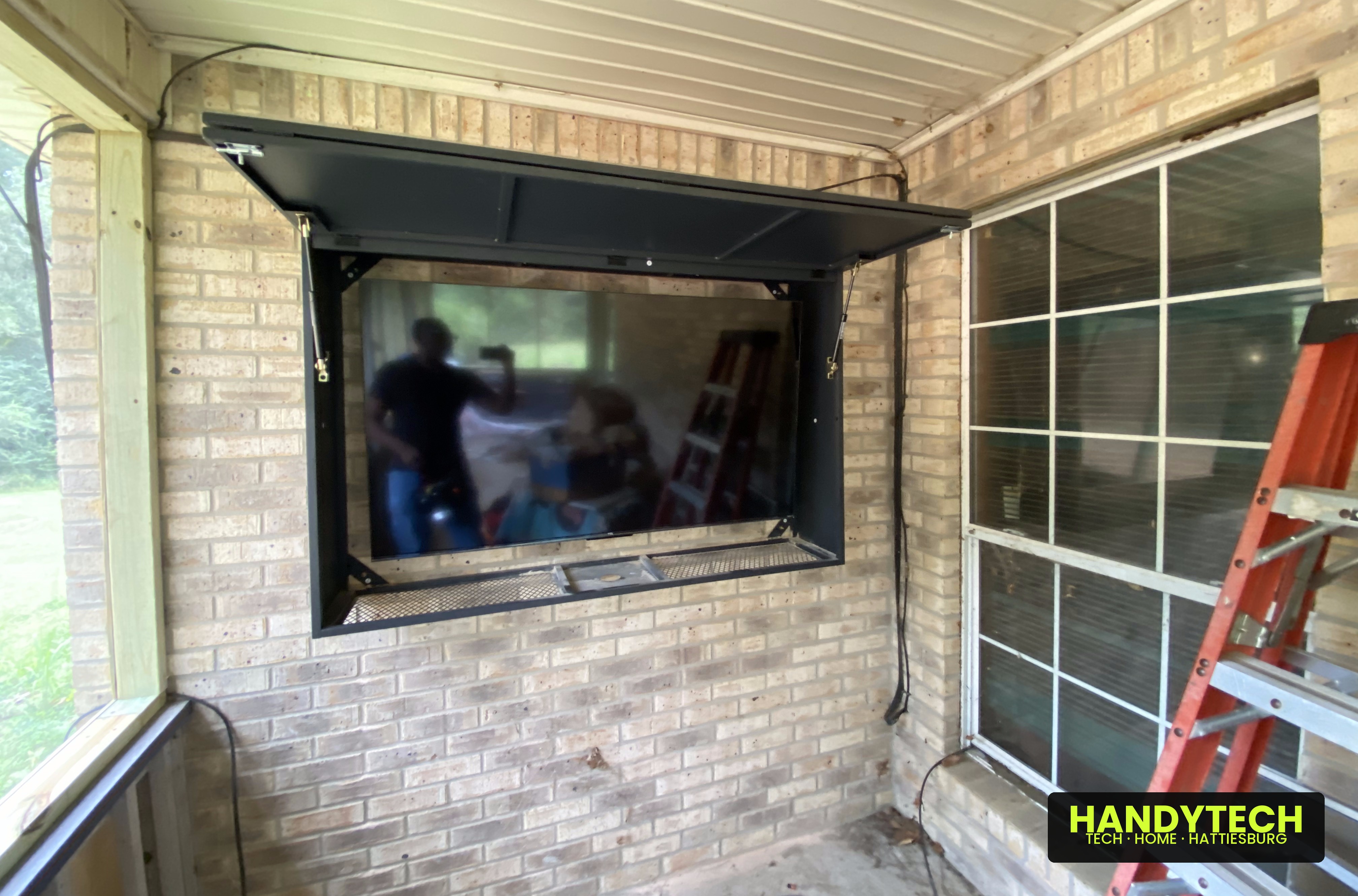 Weatherproof outdoor TV mount in a locking enclosure, Hattiesburg MS